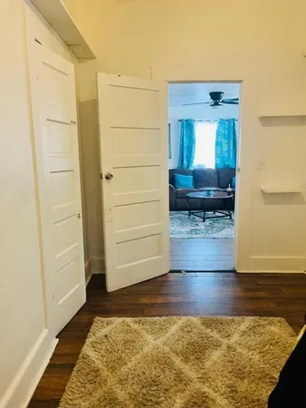 a view of front door with wooden floor