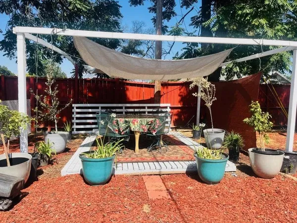 a view of an outdoor sitting area with a tub