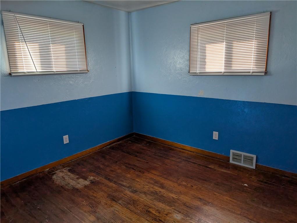 9701 Wilson Street Irwin, PA 15642 - Photo 12 of 20 a view of a room with wooden floor and windows