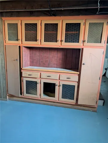 a stove top oven sitting inside of a kitchen