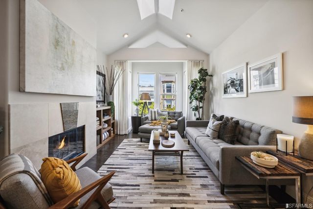 a kitchen with a sink cabinets and wooden floor