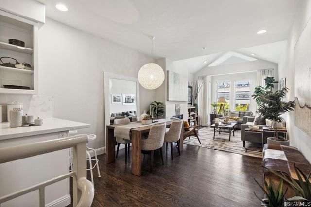 a view of a workspace with furniture and a potted plant