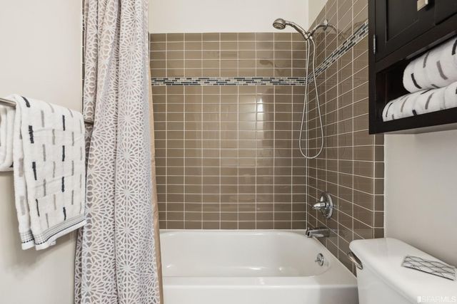 a large kitchen with lots of counter space a sink a window and appliances