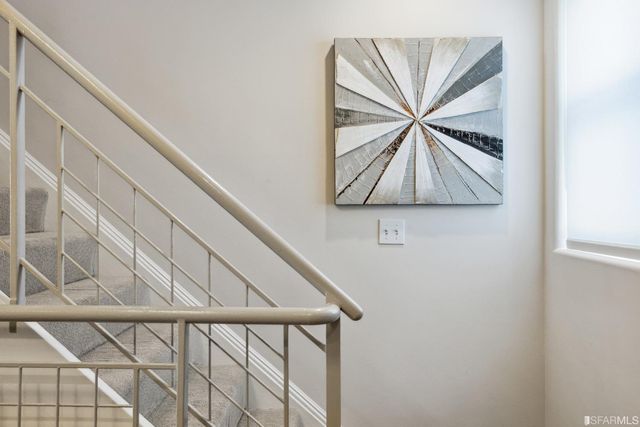a kitchen with stainless steel appliances granite countertop a sink a stove and cabinets