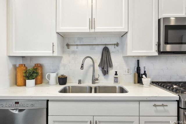 a view of a terrace with couches and sky view
