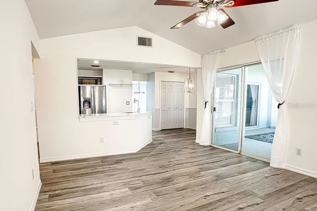 a view of a kitchen cabinets and wooden floor