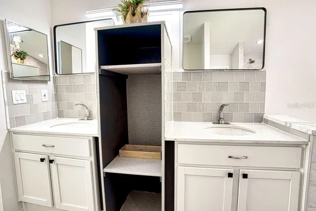 a kitchen with a sink and a refrigerator