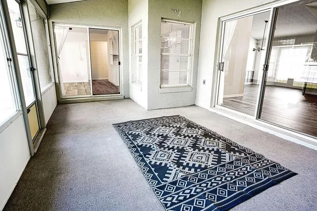 an entryway with a rug