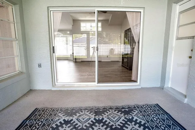 a view of a glass door with a glass door and a window