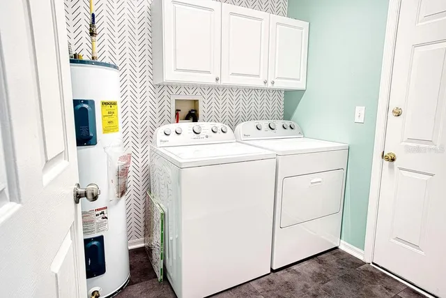 a utility room with dryer and washer
