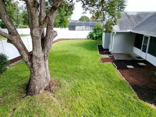 a view of a house with a back yard