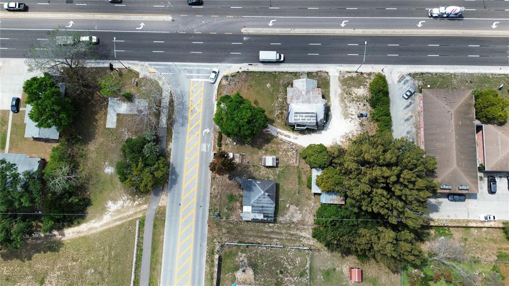 980 South Lake Shore Way Lake Alfred, FL 33850 - Photo 2 of 6 an aerial view of a house with a yard