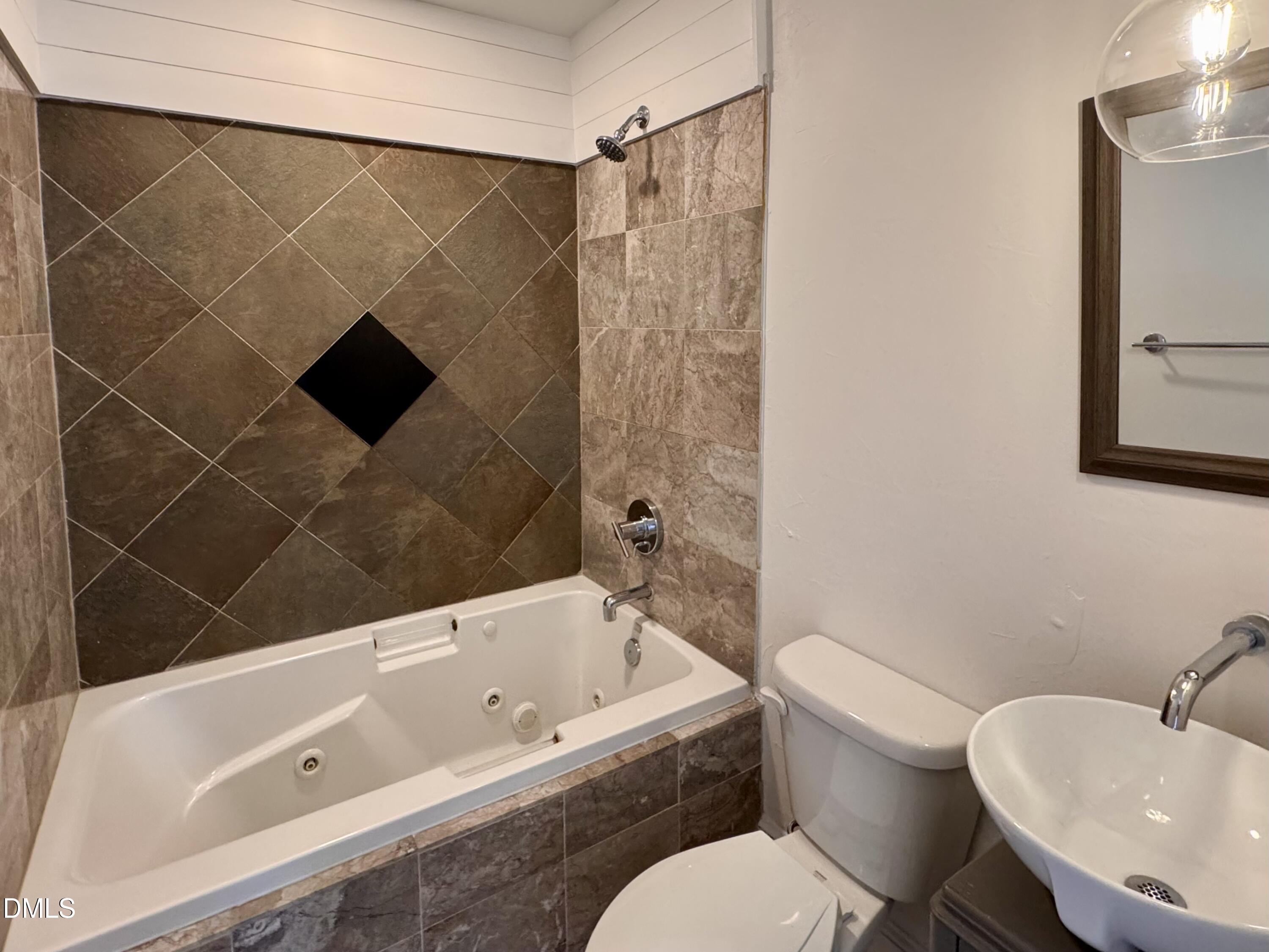 2204 Stafford Avenue, Unit 202 Raleigh, NC 27607 - Photo 10 of 15 a bathroom with a toilet and a bathtub