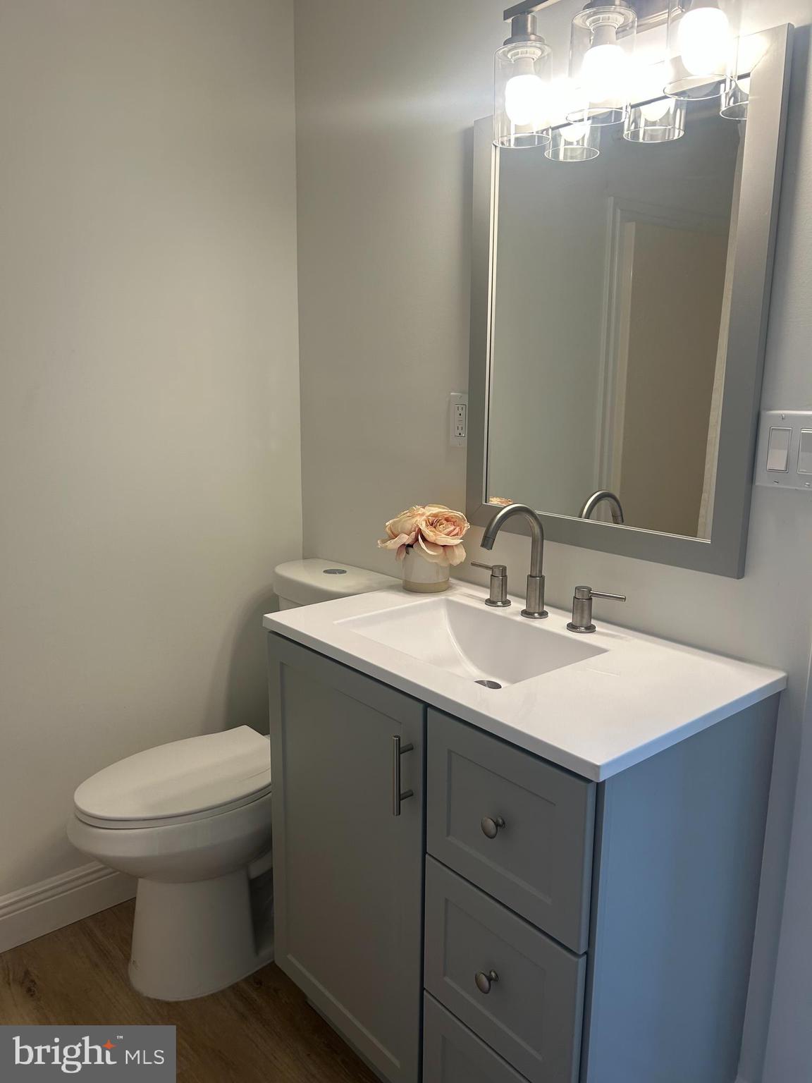 857 Buttonwood Avenue Spring City, PA 19475 - Photo 5 of 10 a bathroom with a toilet sink and mirror