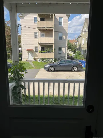 a view of a two chairs and table in a balcony