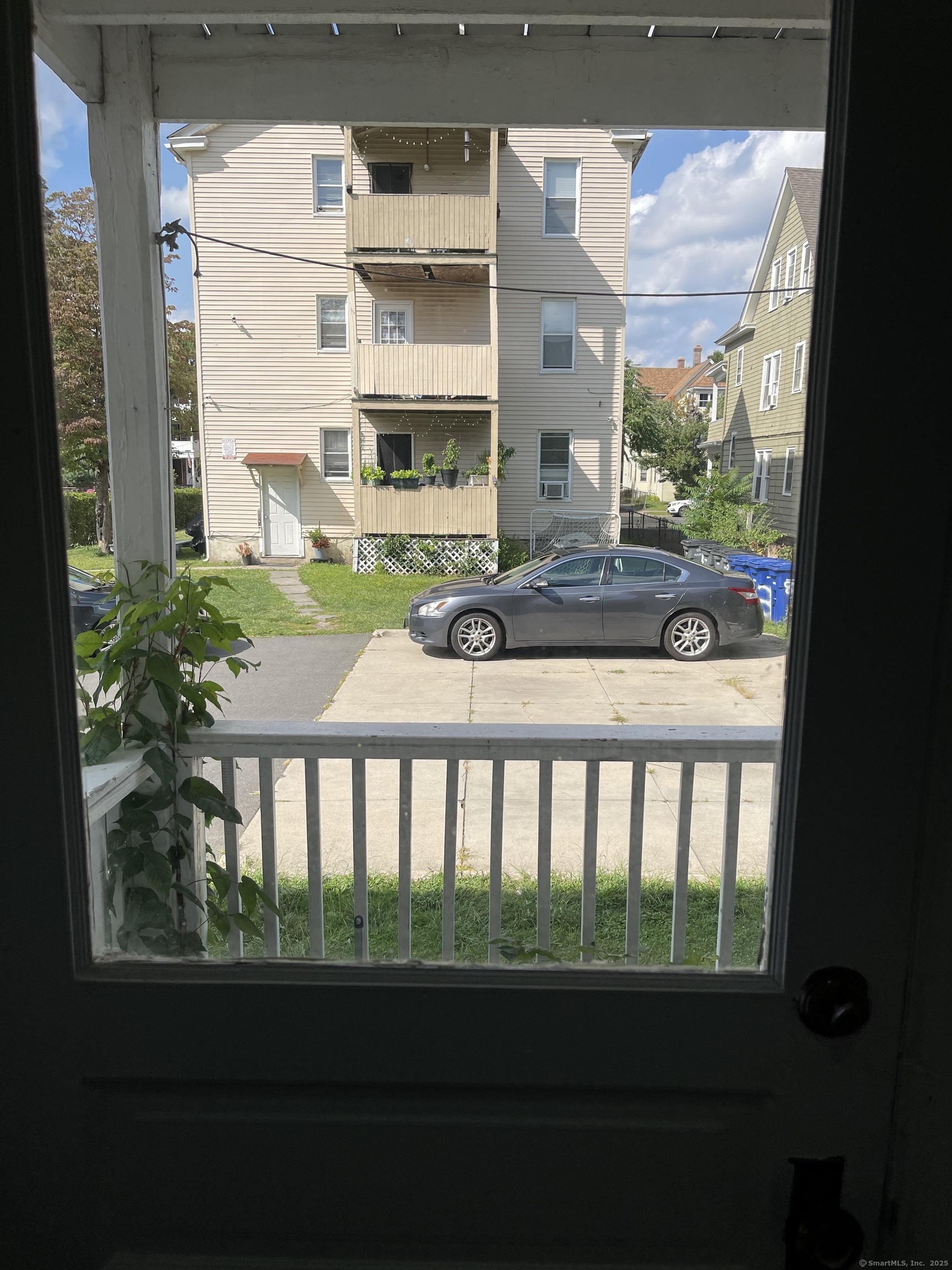 80 Hazel Street Hartford, CT 06106 - Photo 17 of 32 a view of a two chairs and table in a balcony
