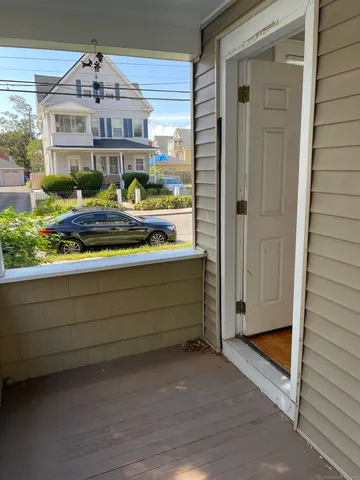 a view of a porch with a bench