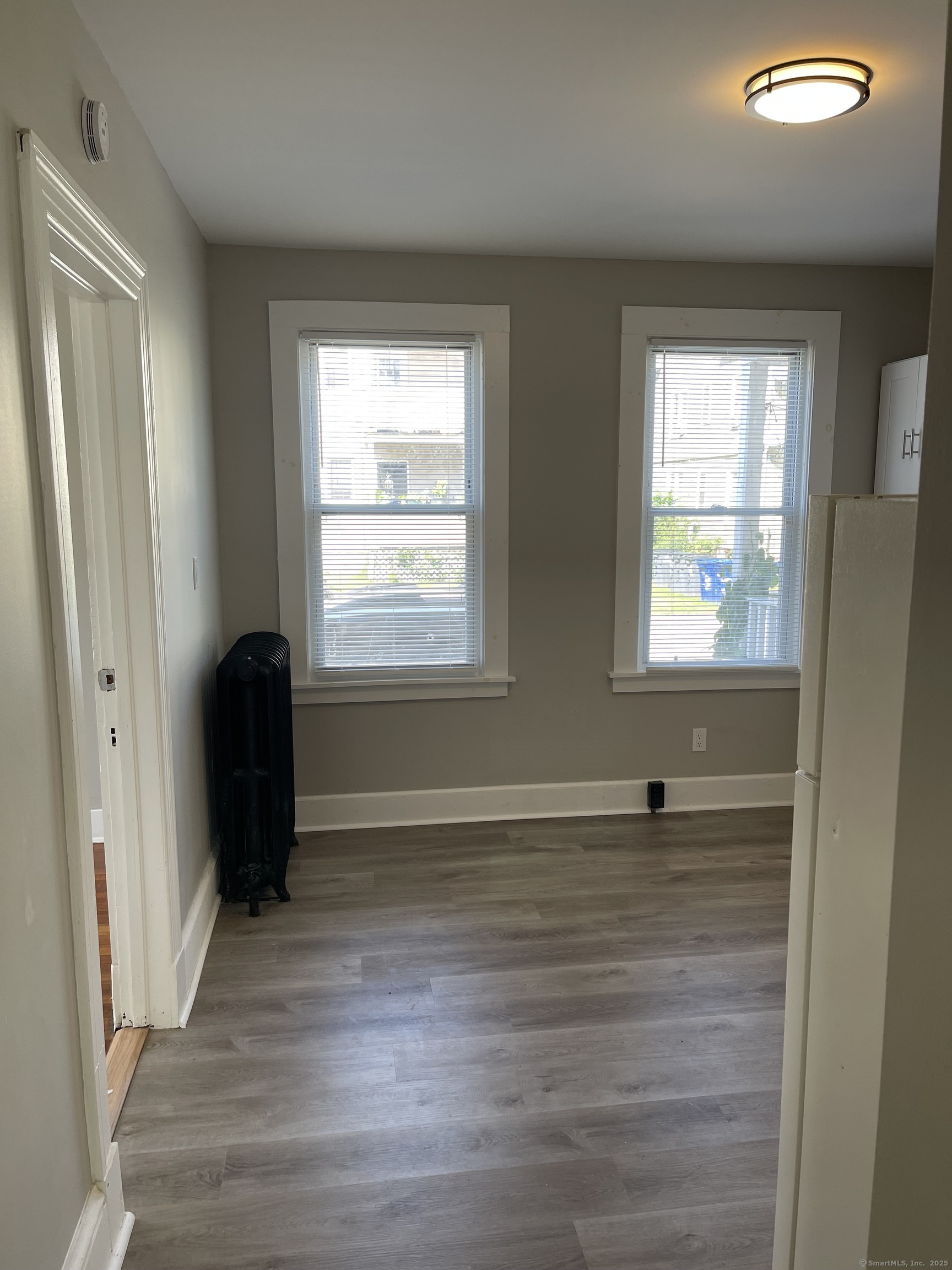 80 Hazel Street Hartford, CT 06106 - Photo 29 of 32 a view of an empty room with wooden floor and a window