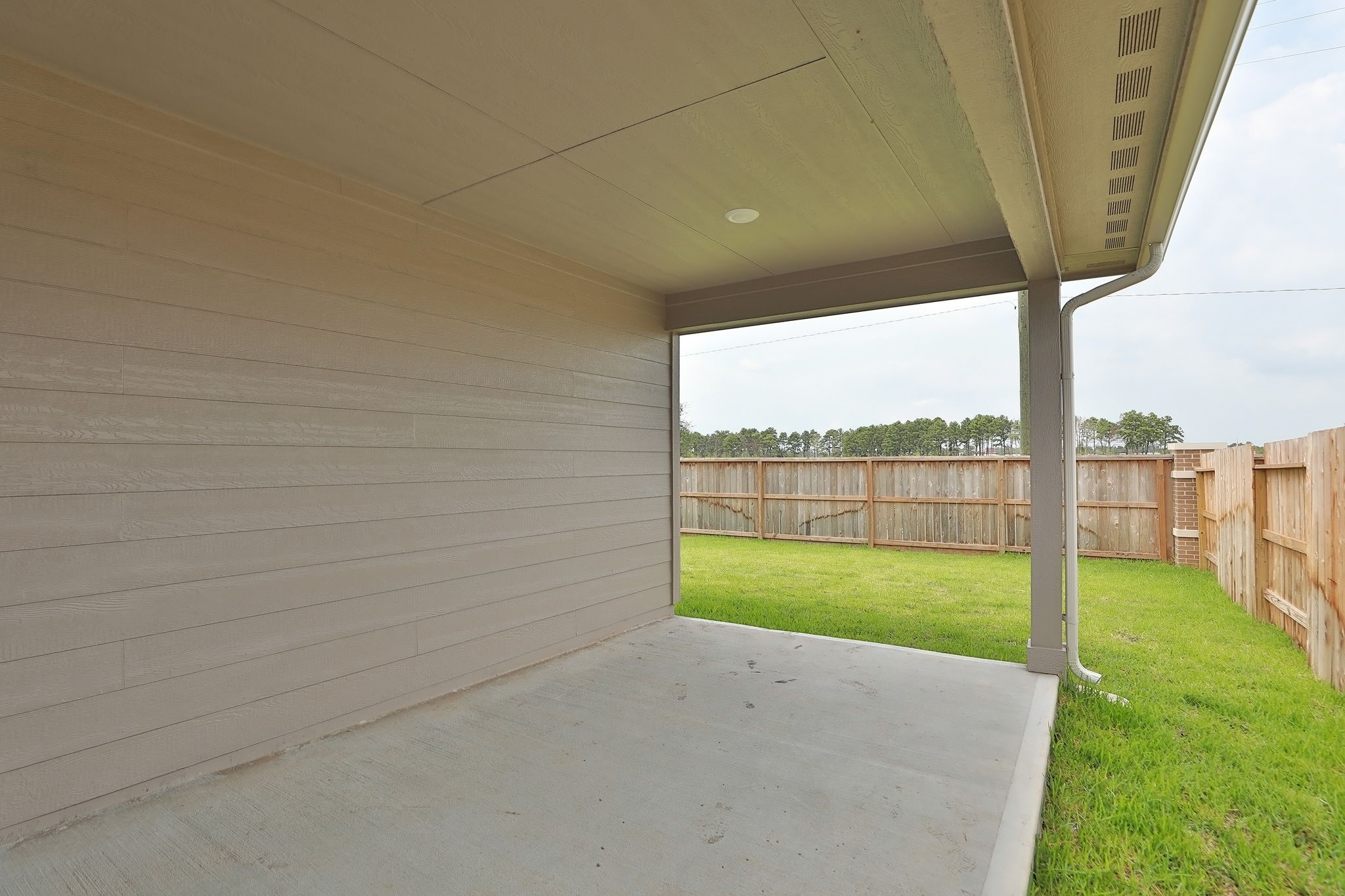 14110 Greystone Ter Street Magnolia, TX 77354 - Photo 22 of 34 An XL Covered Patio Extends The Living Space Outside.