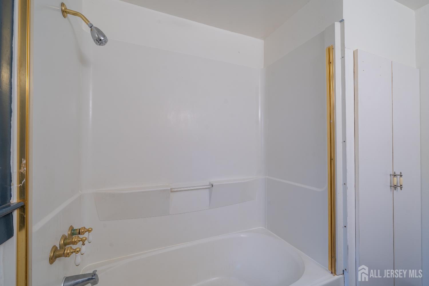 746 Spruce Road North Brunswick, NJ 08902 - Photo 12 of 29 a bathroom with a bathtub