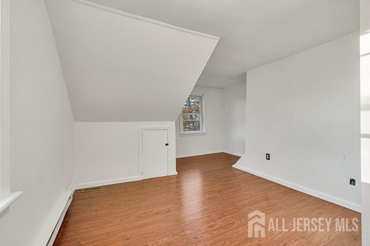 746 Spruce Road North Brunswick, NJ 08902 - Photo 16 of 29 a view of empty room with wooden floor