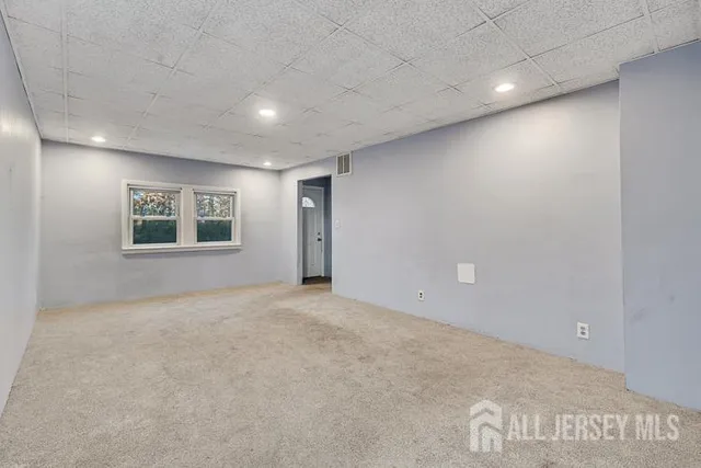 an empty room with a ceiling fan
