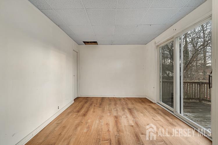 746 Spruce Road North Brunswick, NJ 08902 - Photo 9 of 29 a view of a room with wooden floor and city view