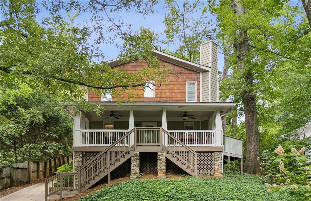 a small house with a tree in front of it