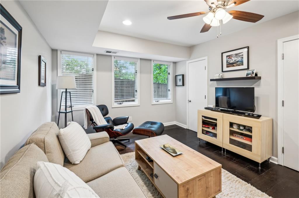 443 Lakeshore Drive Northeast Atlanta, GA 30307 - Photo 13 of 36 a living room with furniture and a flat screen tv