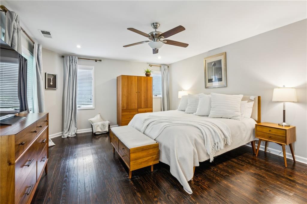 443 Lakeshore Drive Northeast Atlanta, GA 30307 - Photo 16 of 36 a bedroom with a bed and wooden floor