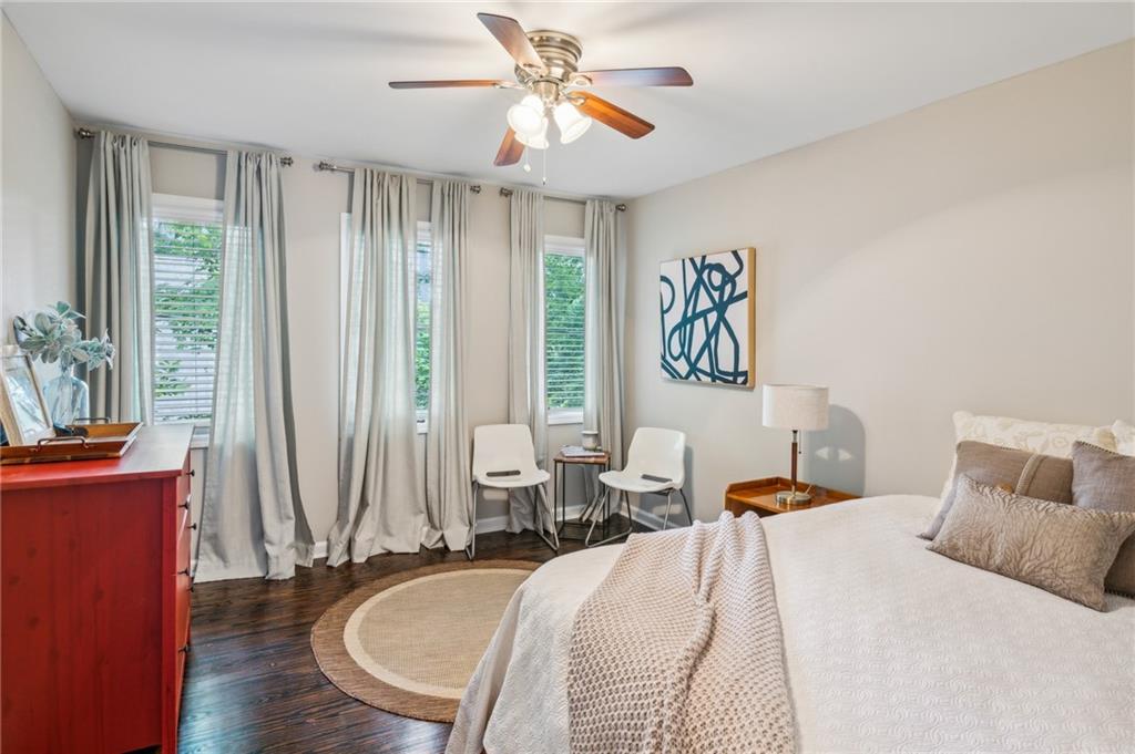 443 Lakeshore Drive Northeast Atlanta, GA 30307 - Photo 19 of 36 a bedroom with a bed and a chandelier