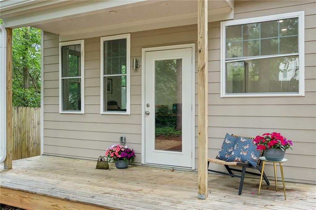443 Lakeshore Drive Northeast Atlanta, GA 30307 - Photo 25 of 36 a flower garden and patio with table