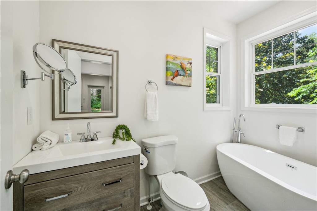 443 Lakeshore Drive Northeast Atlanta, GA 30307 - Photo 29 of 36 a bathroom with a sink and a mirror