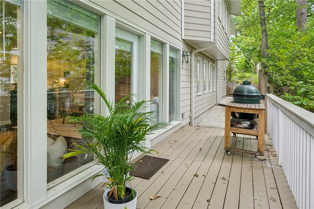 443 Lakeshore Drive Northeast Atlanta, GA 30307 - Photo 9 of 36 a vase of flowers sitting on a wooden floor