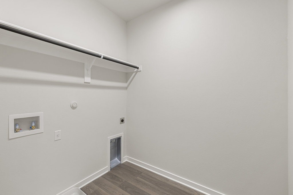 2205 Cento Walk Round Rock, TX 78664 - Photo 18 of 26 Laundry room featuring hookup for a gas dryer, dark wood-style floors, hookup for an electric dryer, and hookup for a washing machine