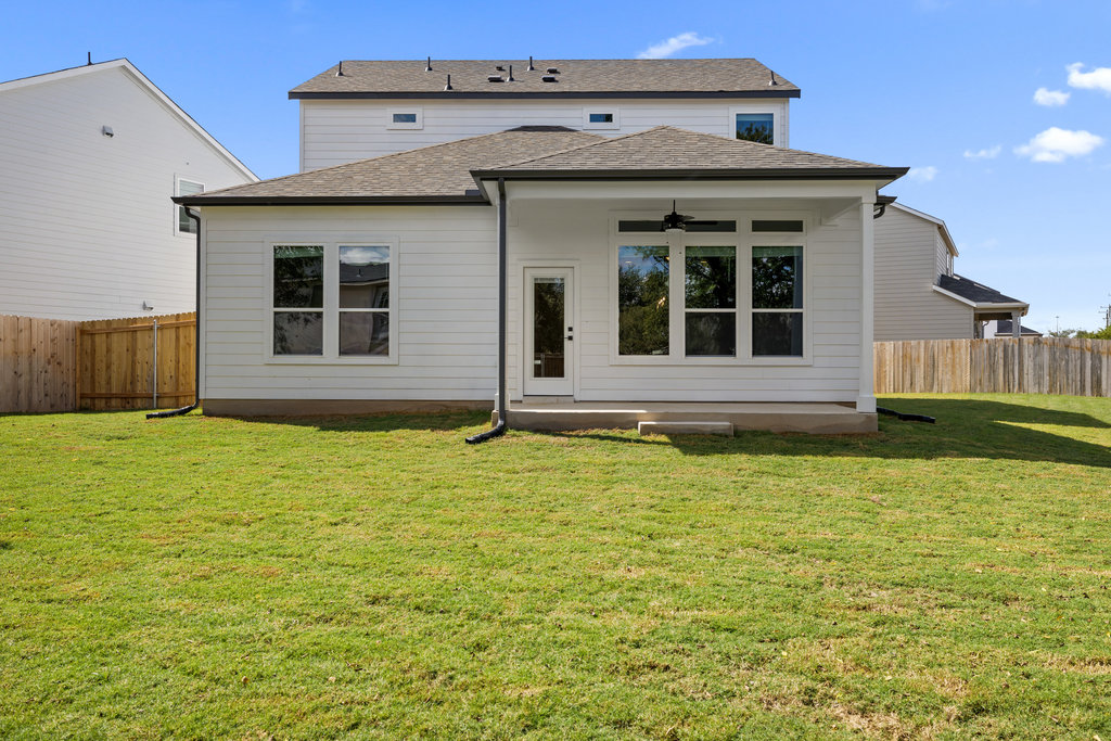 2205 Cento Walk Round Rock, TX 78664 - Photo 20 of 26 Back of property featuring ceiling fan, a fenced backyard, a patio, and roof with shingles