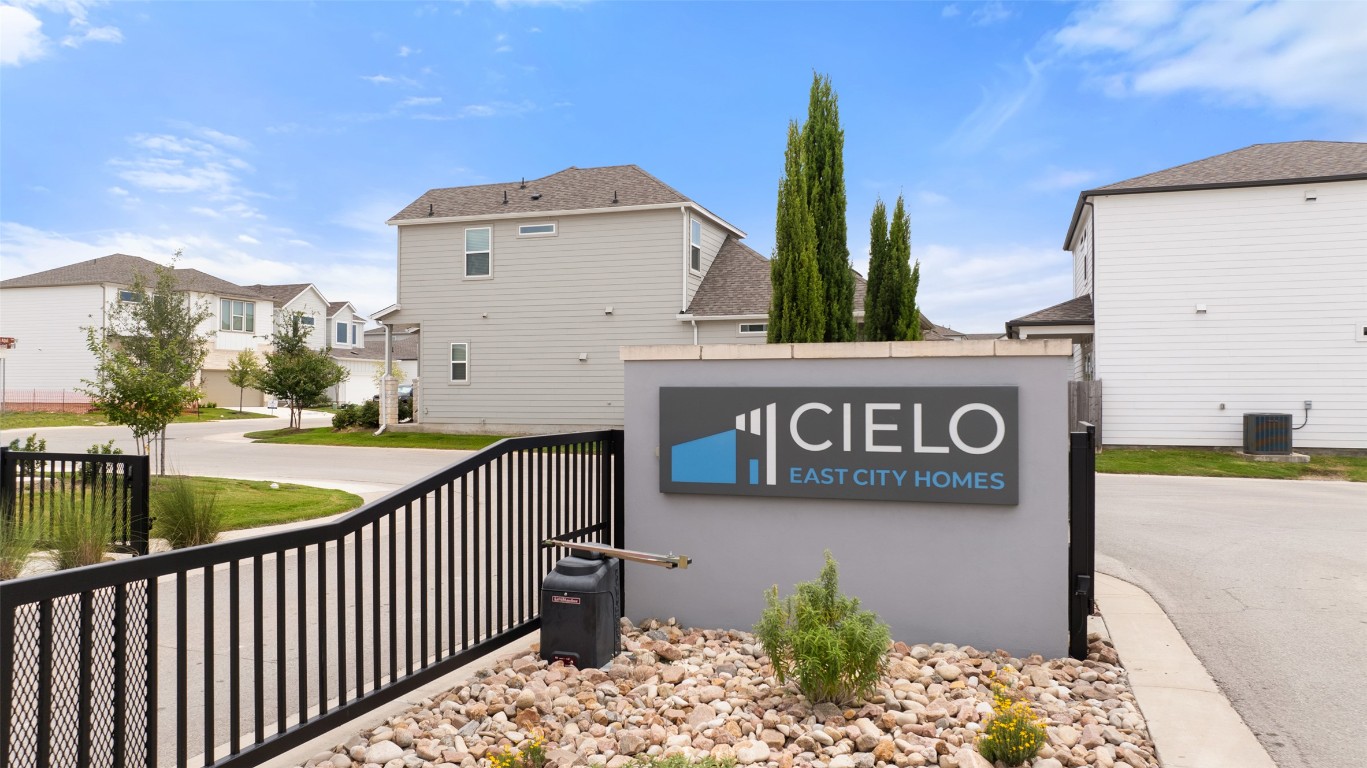 2205 Cento Walk Round Rock, TX 78664 - Photo 22 of 26 Community sign featuring a residential view