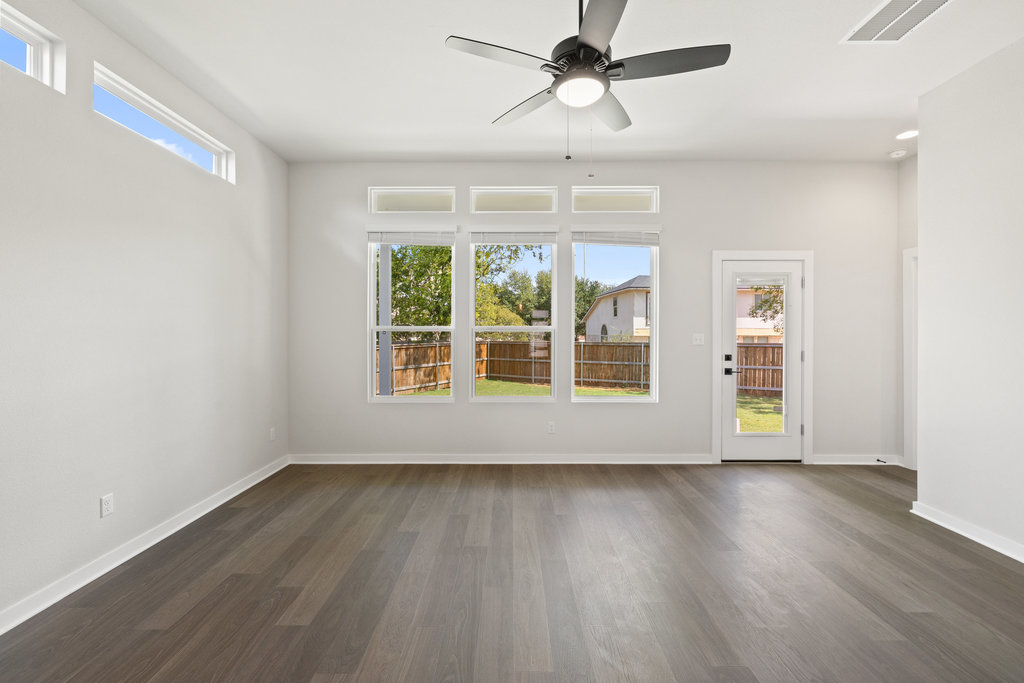 2205 Cento Walk Round Rock, TX 78664 - Photo 7 of 26 Spare room with dark wood-style flooring and ceiling fan