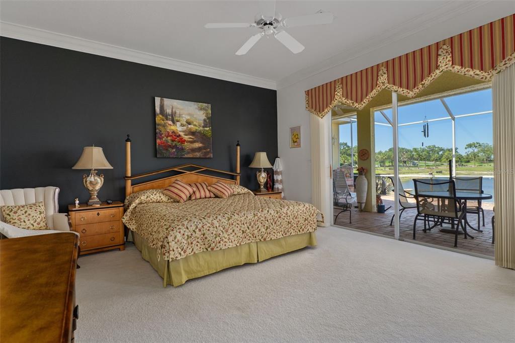 10081 Georgetown Court Weeki Wachee, FL 34613 - Photo 24 of 76 a bedroom with furniture and large windows