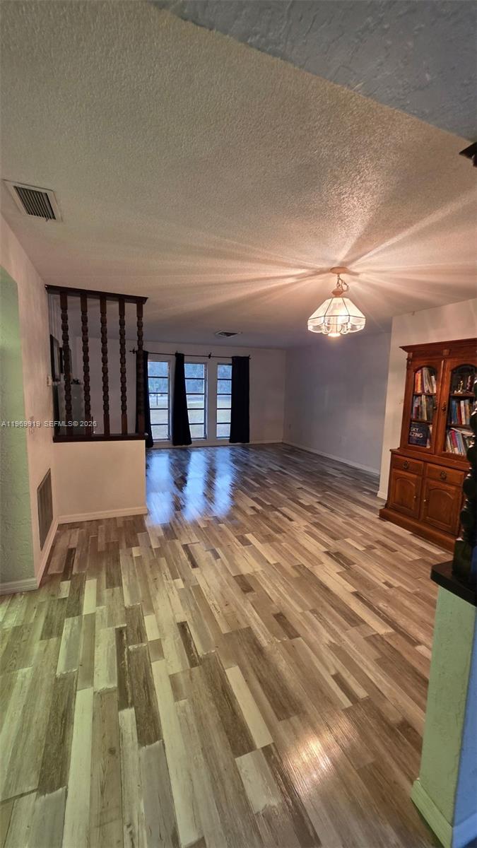 18227 Branch Road Hudson, FL 34667 - Photo 14 of 17 a view of entryway with wooden floor
