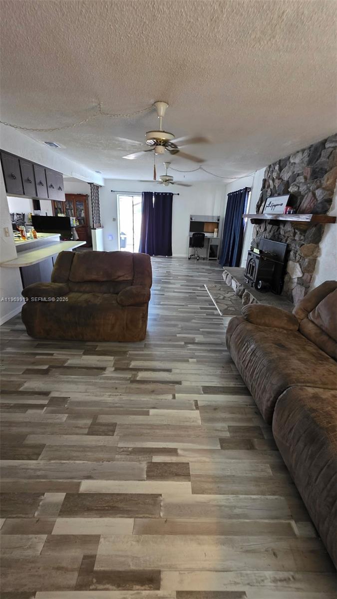 18227 Branch Road Hudson, FL 34667 - Photo 4 of 17 a living room with furniture and a chandelier