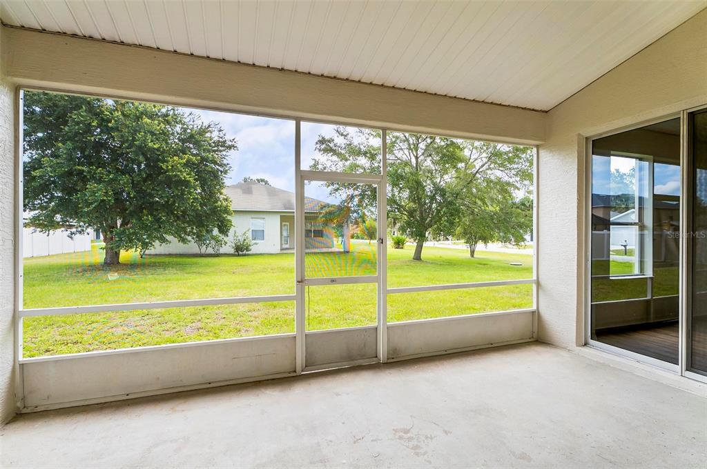 91 Sea Trail Palm Coast, FL 32164 - Photo 13 of 78 a view of swimming pool with an outdoor space and seating area