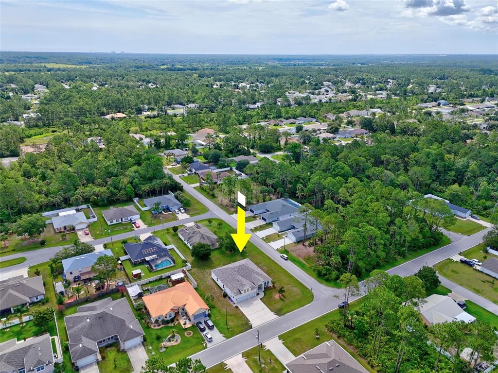 91 Sea Trail Palm Coast, FL 32164 - Photo 16 of 78 an aerial view of residential houses with outdoor space