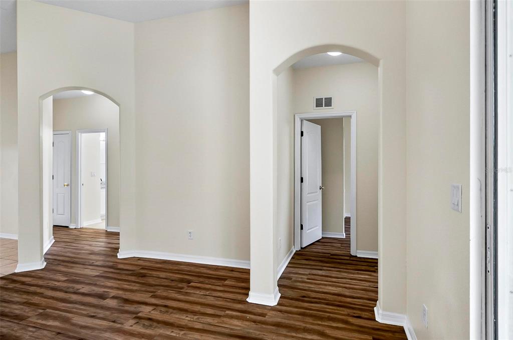 91 Sea Trail Palm Coast, FL 32164 - Photo 20 of 78 a view of a hallway with wooden floor and staircase