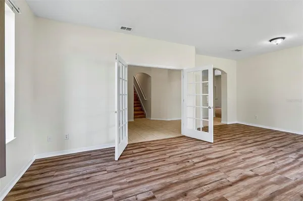 a view of an empty room with a window