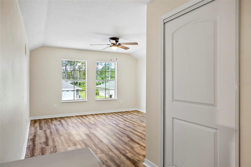 91 Sea Trail Palm Coast, FL 32164 - Photo 33 of 78 a view of an empty room with a window