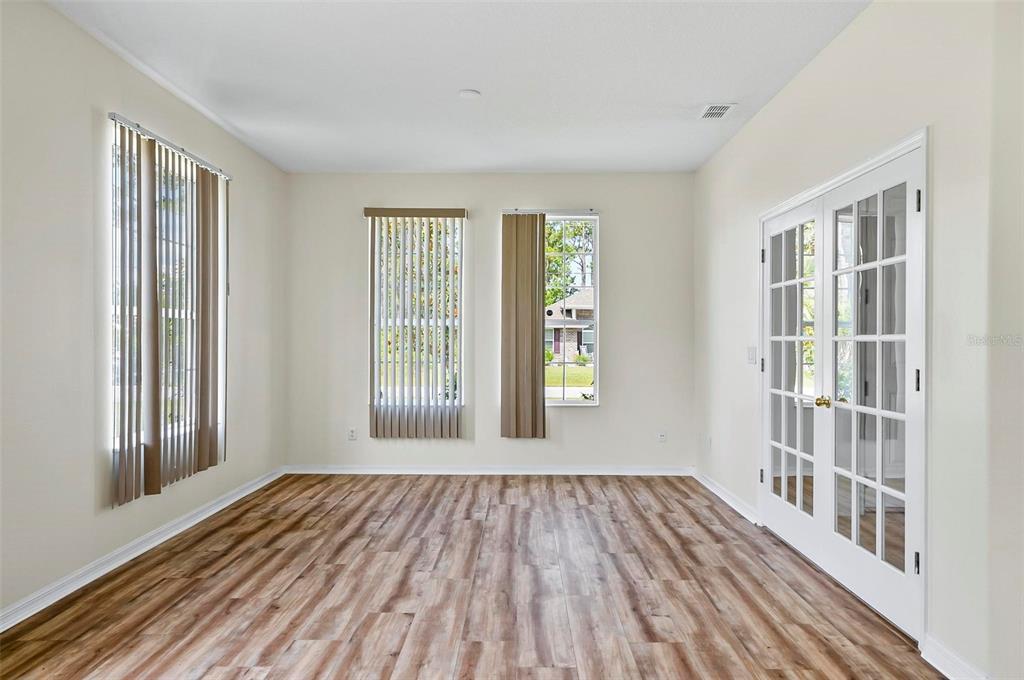 91 Sea Trail Palm Coast, FL 32164 - Photo 35 of 78 a view of a room with wooden floor and windows