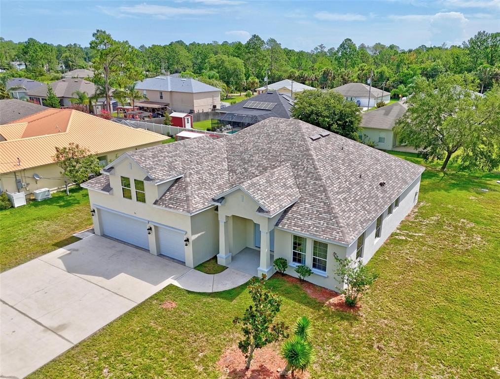 91 Sea Trail Palm Coast, FL 32164 - Photo 6 of 78 an aerial view of a house having yard patio and swimming pool