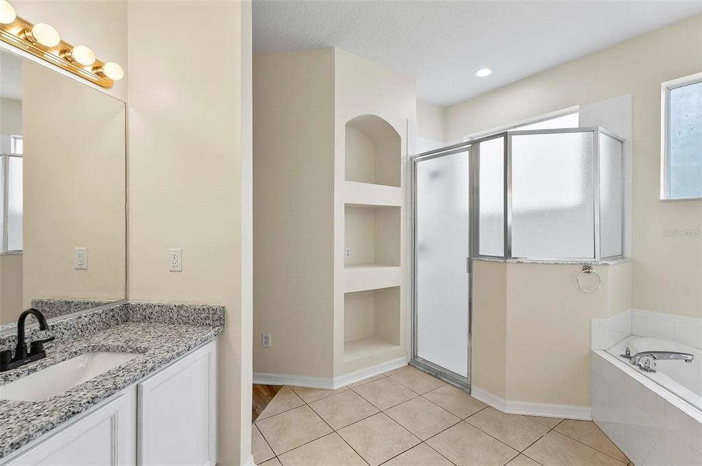 91 Sea Trail Palm Coast, FL 32164 - Photo 64 of 78 a bathroom with a granite countertop sink and a mirror