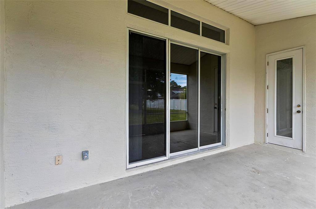 91 Sea Trail Palm Coast, FL 32164 - Photo 70 of 78 a view of an empty room with window